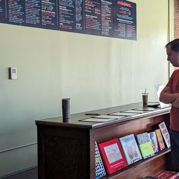 Plain Talk Books & Coffee - a man standing at a counter - Books, Mags, Music & Video Near Me - Des Moines, Iowa Plain Talk Books & Coffee - a man standing at a counter - Books, Mags, Music & Video Near Me - Des Moines, Iowa