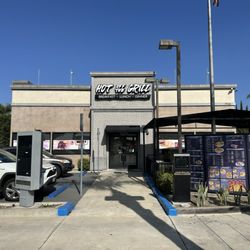 Hot Off the Grill - Picture of the front of the restaurant. You may notice the drive through lane.