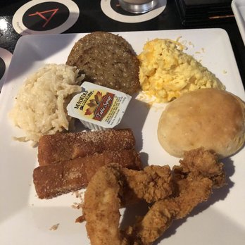 Americana - Eggs, sausage, cheesy potatoes, French toast sticks, fried chicken strips, and a biscuit! - New American Near Me - Des Moines, Iowa