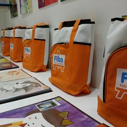 Fibo Kids Art Academy - When you register, you get a bag and shirt. When you buy a supply kit, you get a super great portfolio to keep all your student's artwork in