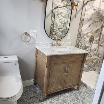 All-Skills Construction - a bathroom with a sink, toilet, and shower - General Contractors Near Me