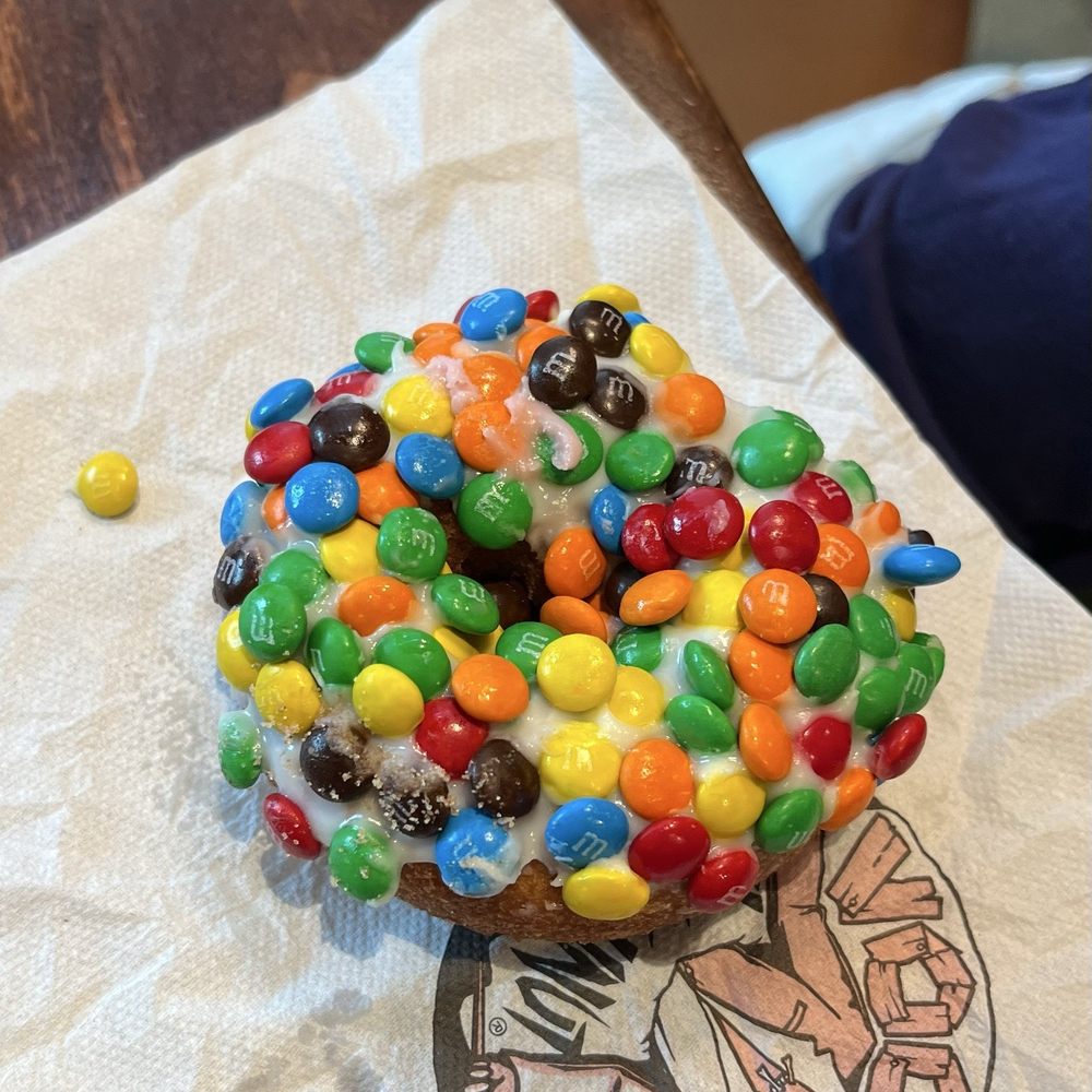 Voodoo Doughnut - Marshall Mathers - cake donut with frosting and small m&m's - Donuts Near Me - Seattle, Washington Voodoo Doughnut - Marshall Mathers - cake donut with frosting and small m&m's - Donuts Near Me - Seattle, Washington