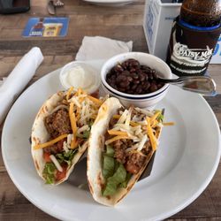 Neptune Grill - Two beef tacos with black beans and rice.