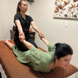Rean Thai massage - This pose presses on the back of the thighs and pulls on the arms allowing entire body to stretch.