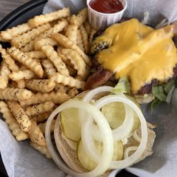 Hamburger, added cheese and bacon, with seasoned fries.