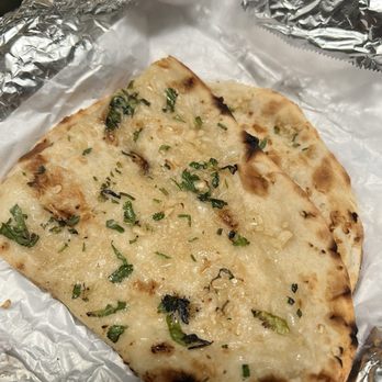 Orange Curry - Garlic Naan - Indian Near Me - Orange, California Orange Curry - Garlic Naan - Indian Near Me - Orange, California