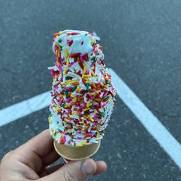 Pistachio soft serve with rainbow sprinkles Pistachio soft serve with rainbow sprinkles