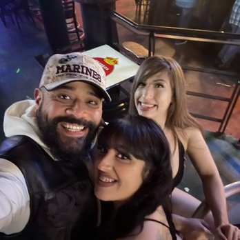 Oasis Lounge - a man and two women taking a selfie - Lounges Near Me - San Antonio, Texas Oasis Lounge - a man and two women taking a selfie - Lounges Near Me - San Antonio, Texas