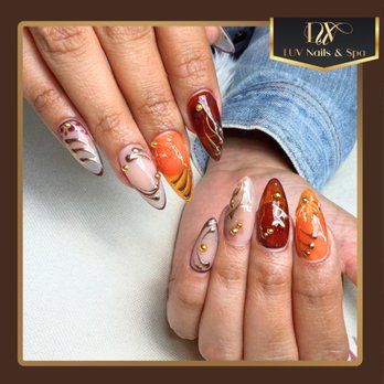 LUV Nails & Spa - A deep, muted base creates a calm and sophisticated vibe, elevated with delicate hand-painted details Gold rhinestones add a luxurious s - Nail Salons Near Me - Bellflower, California LUV Nails & Spa - A deep, muted base creates a calm and sophisticated vibe, elevated with delicate hand-painted details Gold rhinestones add a luxurious s - Nail Salons Near Me - Bellflower, California