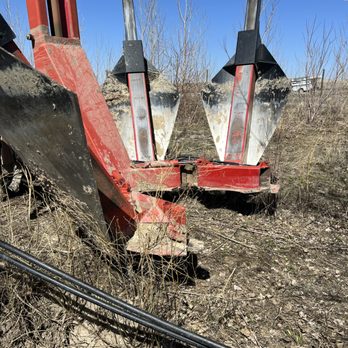 Sprayin Away - a red and black piece of machinery - Lawn Services Near Me - Elwood, Utah
