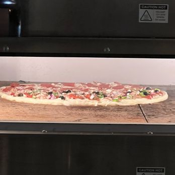 Guardia Pizza and Bar - Pizza just after going in the oven. - Bars Near Me - Cincinnati, Ohio Guardia Pizza and Bar - Pizza just after going in the oven. - Bars Near Me - Cincinnati, Ohio