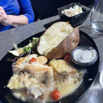 JP Waterfront - Cod piccata style! Baked potato and coleslaw as sides! - Bars Near Me - Gibraltar, Michigan