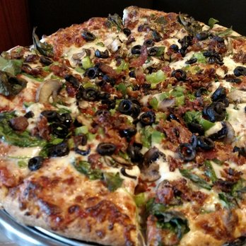 Leonardo's Italian Grille - Positioning myself for GREATNESS with medium veggie pizza with bacon and spinach! - Pizza Near Me - Romulus, Michigan
