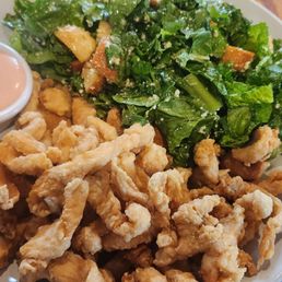 Chicharron de Pollo with a Caesar salad. Chicharron de Pollo with a Caesar salad.