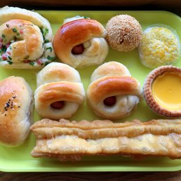 a green plate with a variety of food items