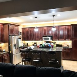 Accent Lighting of the Grand Strand - The warm white lighting brightened up this dark cherry kitchen perfectly.