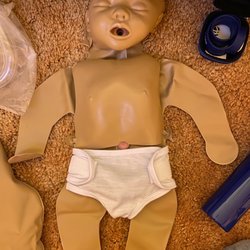 Fragile Heart CPR - INFANT front. Feedback monitor wristlet in corner.