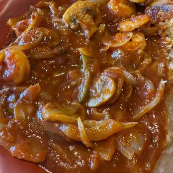 Chapala Mexican Restaurant - Horrible. Camarones a la diabla - A dish featuring shrimp, sliced mushrooms, and onions in a savory, reddish sauce, accompanied by rice on a red plate. - Mexican Near Me - Eugene, Oregon