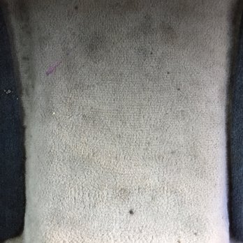 Clean Green Mobile - The divider on the floor in the back seat was spotted with stains. - Auto Detailing Near Me Clean Green Mobile - The divider on the floor in the back seat was spotted with stains. - Auto Detailing Near Me