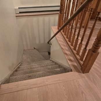 Empire Today - craftsmanship around bottom of banister - Carpet Installation Near Me Empire Today - craftsmanship around bottom of banister - Carpet Installation Near Me
