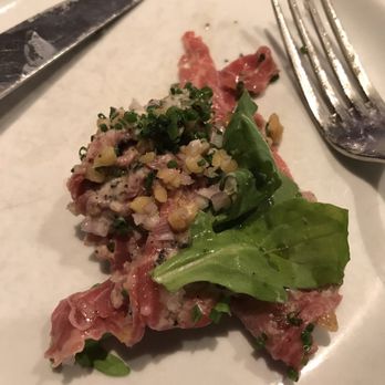 Carbone - Carpaccio with crushed walnut and truffle. It comes with mushroom but they kindly kept it out per my request - Italian Near Me - New York, New York Carbone - Carpaccio with crushed walnut and truffle. It comes with mushroom but they kindly kept it out per my request - Italian Near Me - New York, New York
