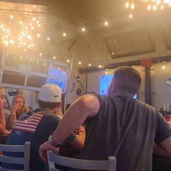 BrewBurgers Back Porch - inside a large group seemed happy!! - Burgers Near Me - Venice, Florida