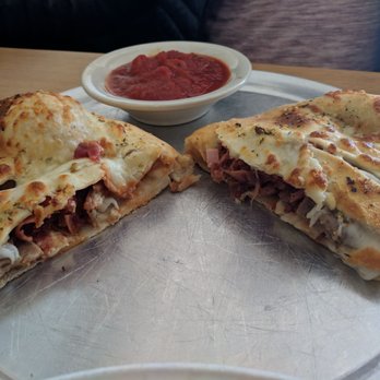 Sliced Pizza and More - Meal lovers calzone - Pizza Near Me - Manassas, Virginia Sliced Pizza and More - Meal lovers calzone - Pizza Near Me - Manassas, Virginia