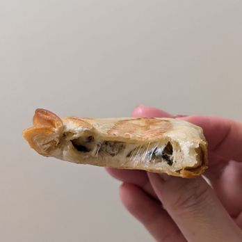 Las Muns - Cross-section of my mushroom and camembert empanada - Spanish Near Me - Toronto, Ontario Las Muns - Cross-section of my mushroom and camembert empanada - Spanish Near Me - Toronto, Ontario