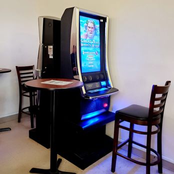Eve's Deli - a gaming machine and a chair - Delis Near Me - Gresham, Oregon