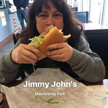 Jimmy John's - a woman eating a sandwich - Delis Near Me - Machesney Park, Illinois Jimmy John's - a woman eating a sandwich - Delis Near Me - Machesney Park, Illinois