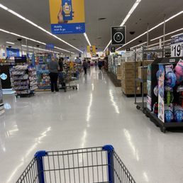 a shopping cart in the aisle a shopping cart in the aisle
