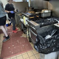 Nasty ass grill oh and take a look at the bag of fries sitting on the ground just chilling
