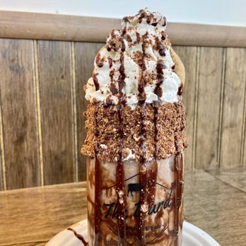 The Yard Milkshake Bar - a chocolate milkshake with whipped cream and chocolate syrup - Ice Cream & Frozen Yogurt Near Me - Columbus, Ohio