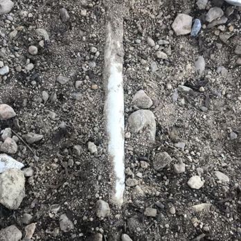Bracken's Landscaping - Left water lines exposed over rocks he was supposed to remove. - Landscaping Near Me - adelanto, California Bracken's Landscaping - Left water lines exposed over rocks he was supposed to remove. - Landscaping Near Me - adelanto, California