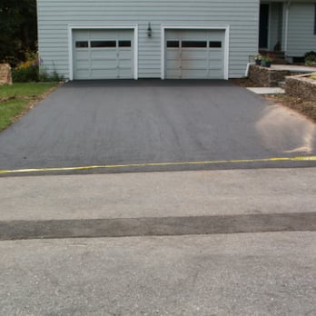 Maine Pavement - a driveway with yellow tape - General Contractors Near Me - Saco, Maine