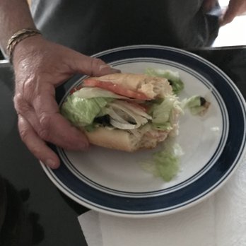 Paladino's Italian Eatery - 1/2 Turkey and American cheese sandwich on dinner plate - Delis Near Me - Apache Junction, Arizona