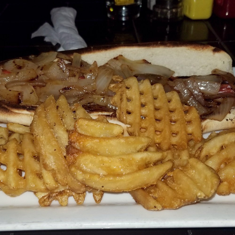 My delicious foot long hot dog with onion topping and fries