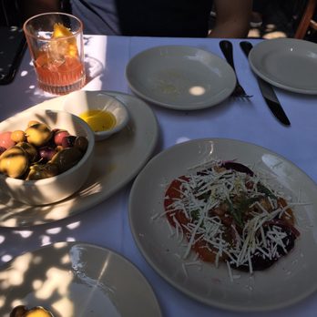 Lupa - Beets with Ricotta & Pistachios, Olives, Fresh bread & Olive oil - Italian Near Me - New York, New York Lupa - Beets with Ricotta & Pistachios, Olives, Fresh bread & Olive oil - Italian Near Me - New York, New York