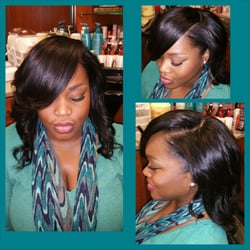 Full sew in with deep side part and minimal leave out.