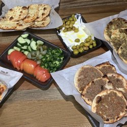 The Heights Meat Market & Grill - Mini zaatar, meat, cheese and pizza manaeesh with labne and veggies.