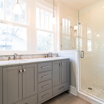 CenterBeam Construction - Remodeled Bungalow: Master bathroom: with two sink vanity, tiled floors, and fully tiled walk in shower. - General Contractors Near Me - Jacksonville, Florida