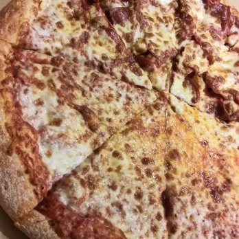 Uncle Nick's Pizza - Large pizza half cheese half pepperoni and sausage. - Pizza Near Me - Port Charlotte, Florida