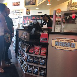 a man and a woman standing in front of a counter a man and a woman standing in front of a counter