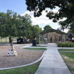 Front entrance. Cute teepee and rock wall to left.