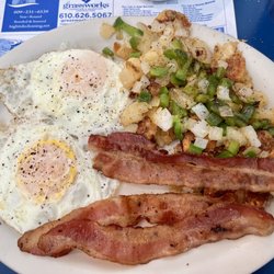 Two eggs over easy with bacon & homefries well done with peppers & onions
