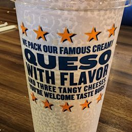 a plastic cup with a straw