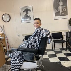 Sit-N-Bull Barbers - My big boy finishing up his haircut!