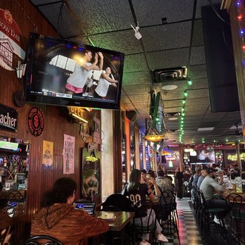 Hawkeye's Bar & Grill - Dining area with big screen tv - Sports Bars Near Me - Chicago, Illinois Hawkeye's Bar & Grill - Dining area with big screen tv - Sports Bars Near Me - Chicago, Illinois