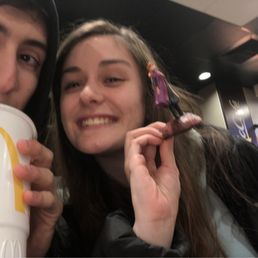 a man and a woman holding a cup of coffee