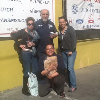 A & E Auto Center - Happy customers and the owner, Ali. Ali gave the customers bread! :) - Auto Repair Near Me - San Francisco, California
